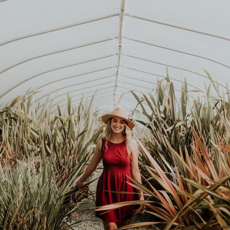Alexandra Reed, Lead Design Curator at Orbit Note Modern, reviewing corporate floral arrangements